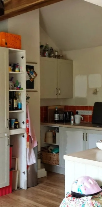 Before — Carrara marble · beamed cottage kitchen