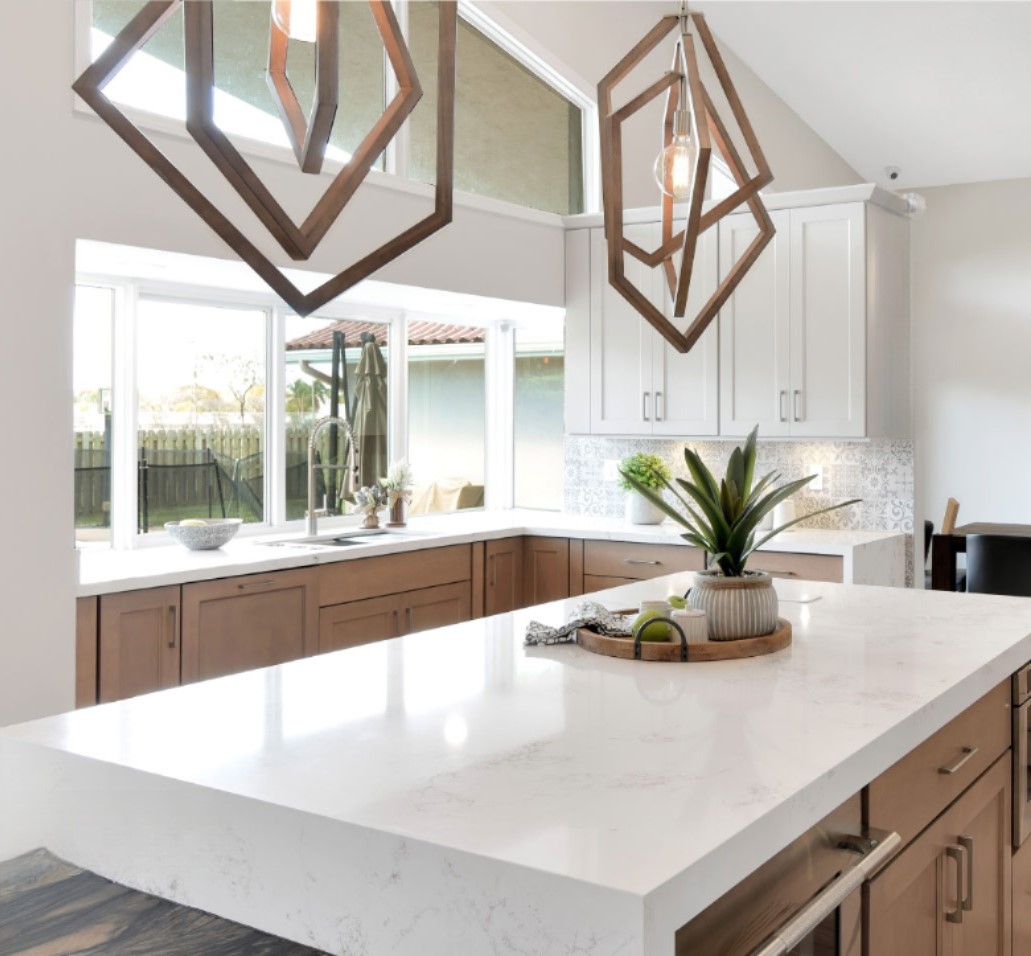 After — Calacatta quartz island · light oak kitchen